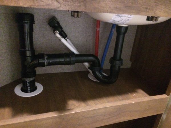 a view of the inside of a bathroom sink cabinet