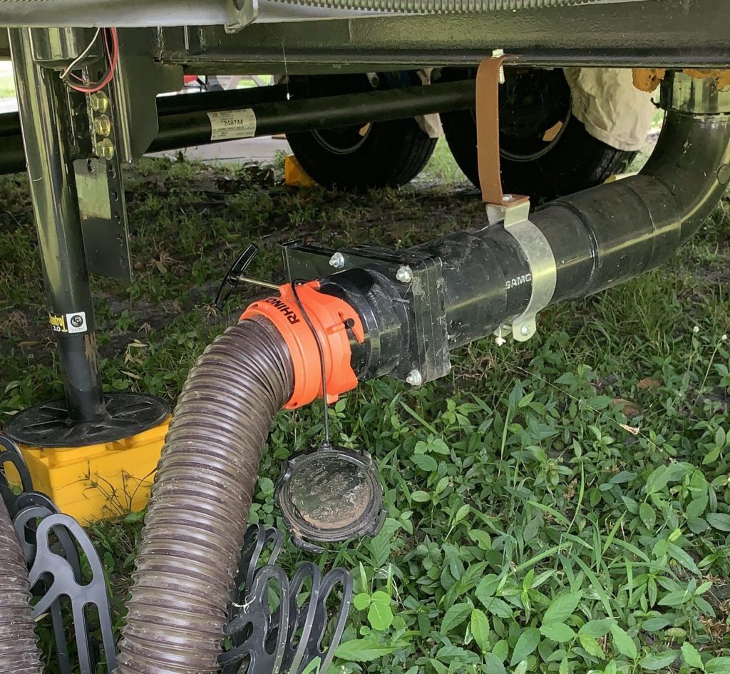 View of the kitchen waste water tank dump valve with the handle facing away from the viewer