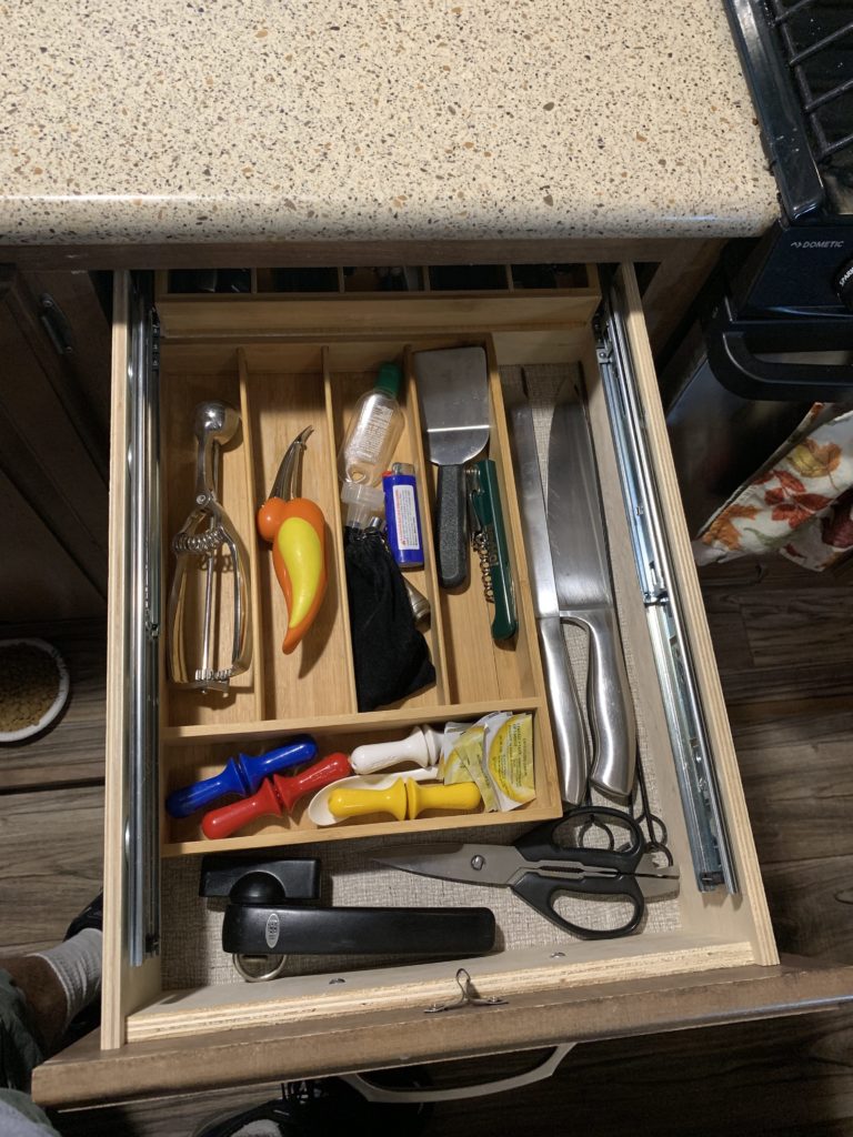 view of the inner drawer full retracted and full of utensils